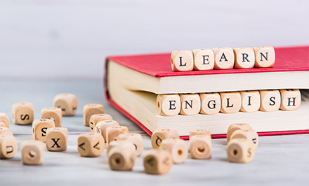 wooden blocks spelling learn english next to a red book on a wooden surface educational resources six strategies for learning