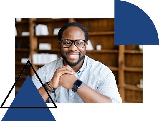 smiling man with glasses in a modern setting showcasing a positive vibe and professional atmosphere ideal for one on one interaction